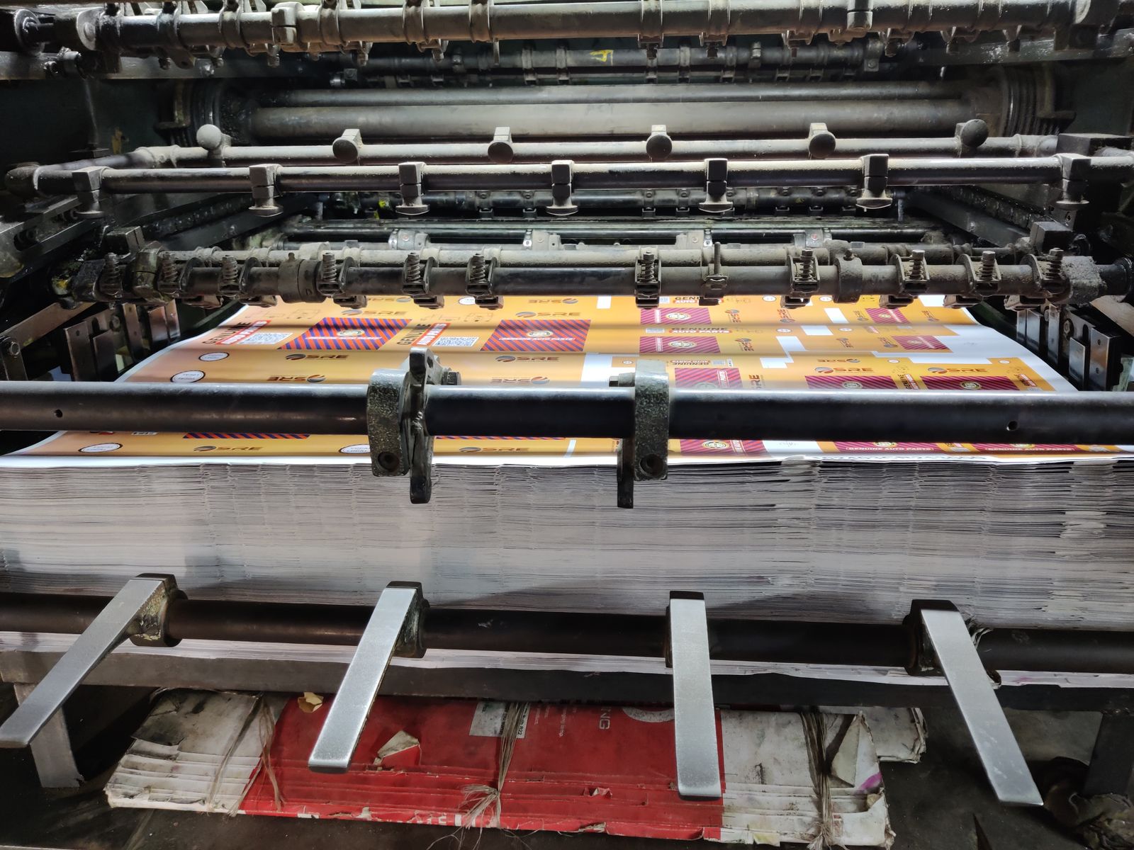 Industrial printing machine processing printed paper sheets
